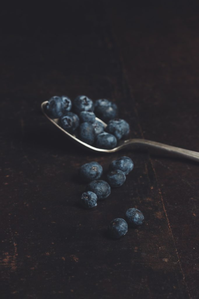 A spoonful of blueberries, one of our favorite superfoods 

