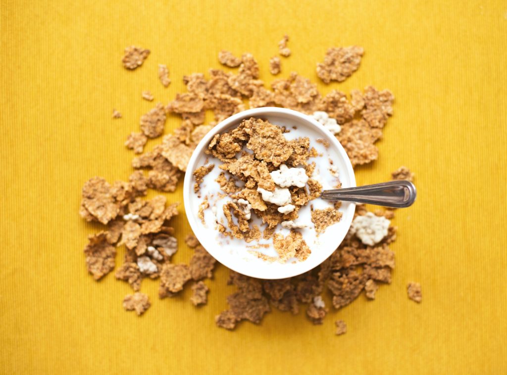A bowl of cereal using alternative milk represents various cooking substitutions that can be used to increase nutritional value. 