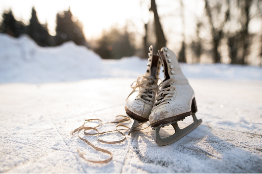 white ice skates on a frozen pond in 